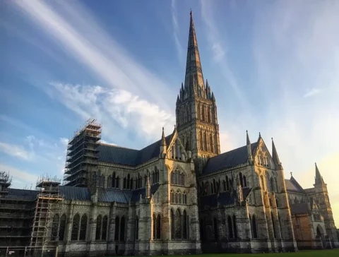Salisbury cathedral with sunset behind